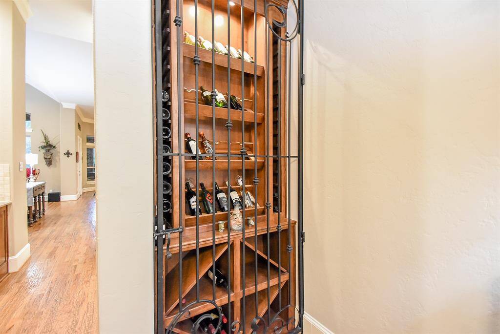 The wine grotto in the dining room has a custom-made wrought iron door.