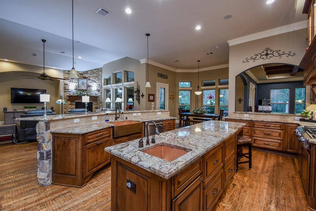 Hand-hammered copper farmhouse sink and prep sink in the kitchen.