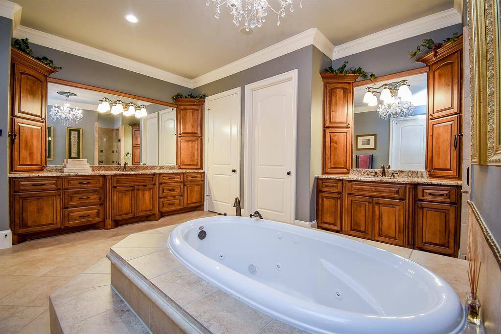 Primary bath features two vanity areas...
