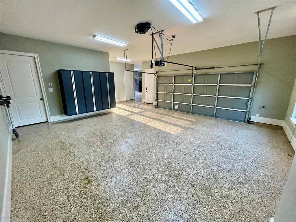 This is the first of two 2-car garages. Epoxy floor through both garages.