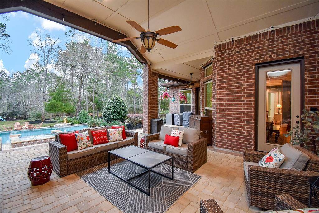 Patio overlooks the gorgeous pool and backyard.