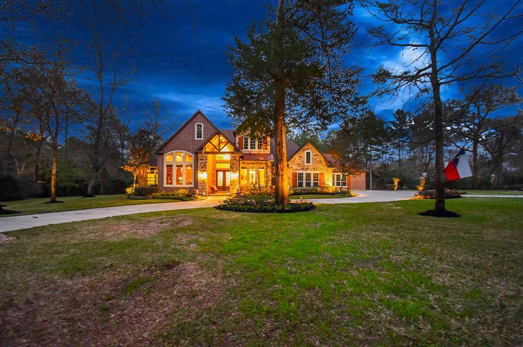 Outdoor lighting on the house and throughout the property provide a tranquil setting at night.