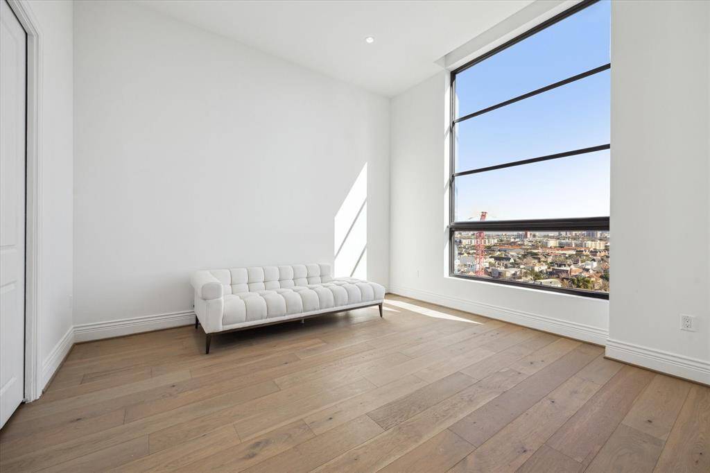 This spacious secondary bedroom with ensuite bath is the perfect retreat for guests.
