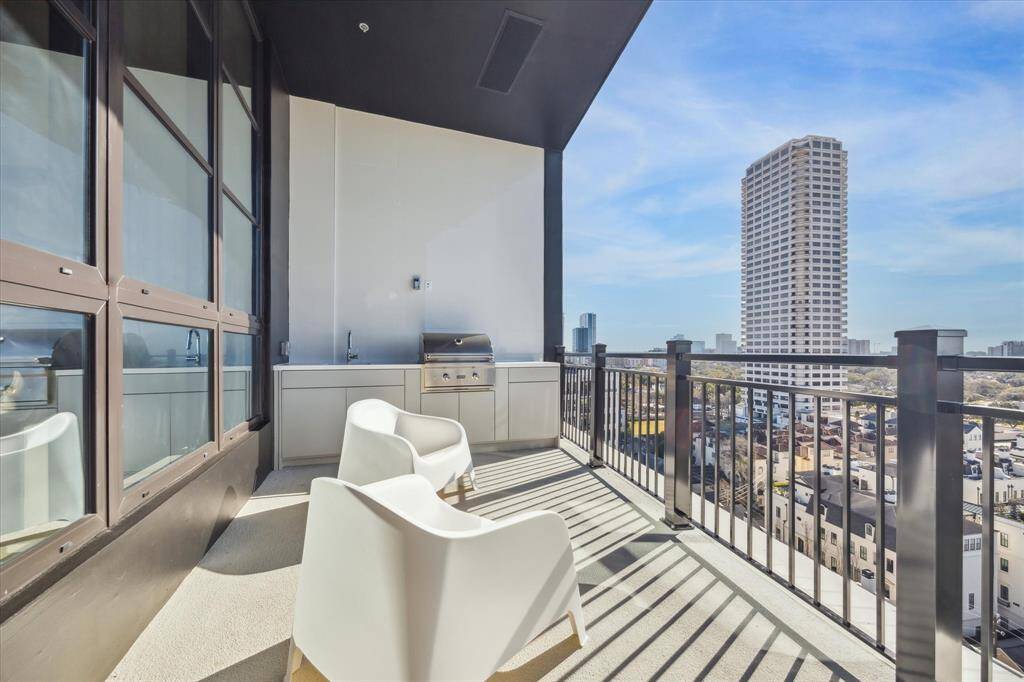 The balcony offers space for relaxing and stargazing. The summer kitchen has gas grill, sink and storage beneath.
