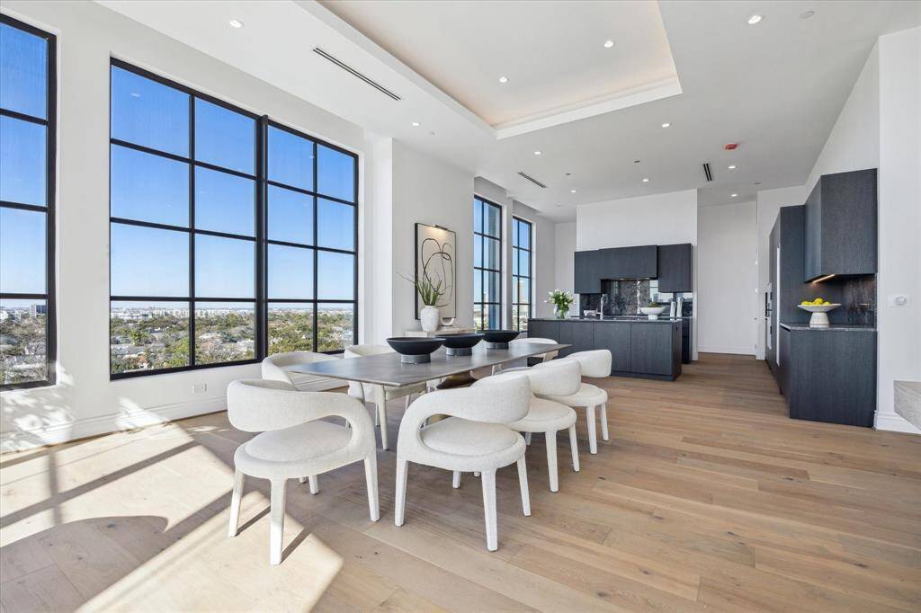 The dining area is seamlessly connected to the kitchen highlighting the home's open design, where every detail is thoughtfully crafted.