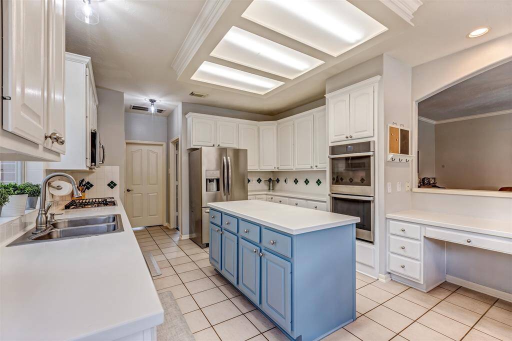 Updated stainless steel appliances look great with the updated island.