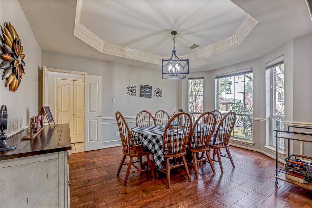The well appointed formal dining with tray ceiling and updated lighting.