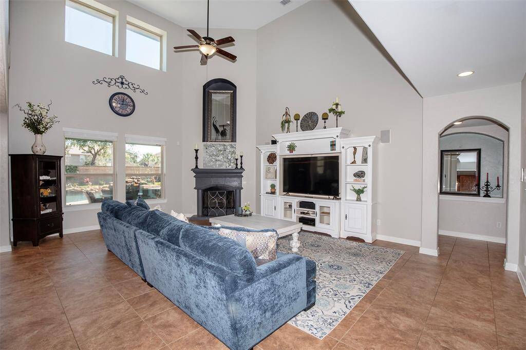 The expansive two-story family room is the heart of the home, offering a grand yet inviting atmosphere.