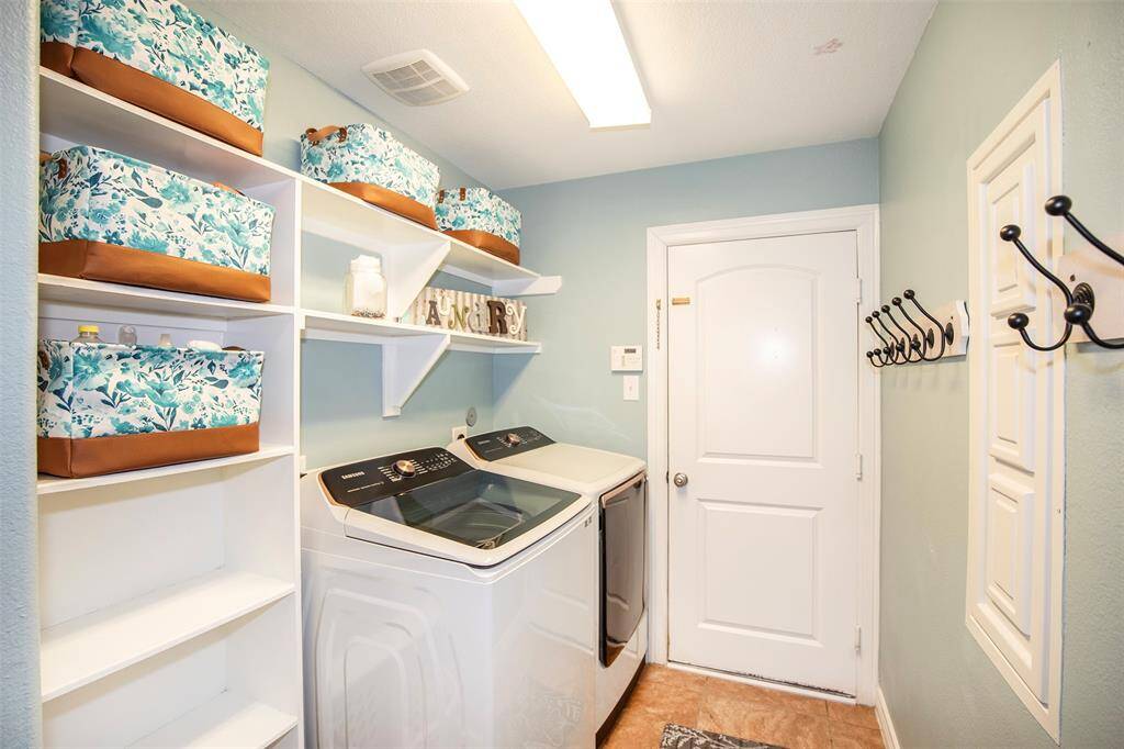 The utility room is located on the main level of the home.