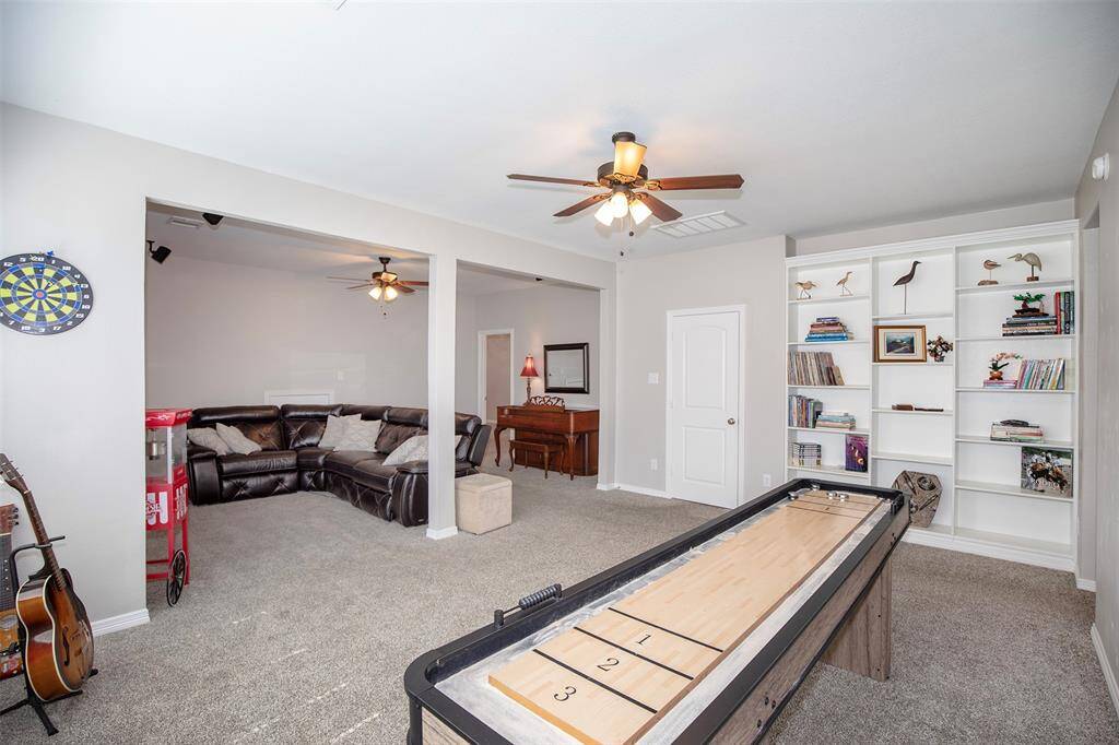 Upstairs, a media room and a game room offer endless entertainment possibilities.