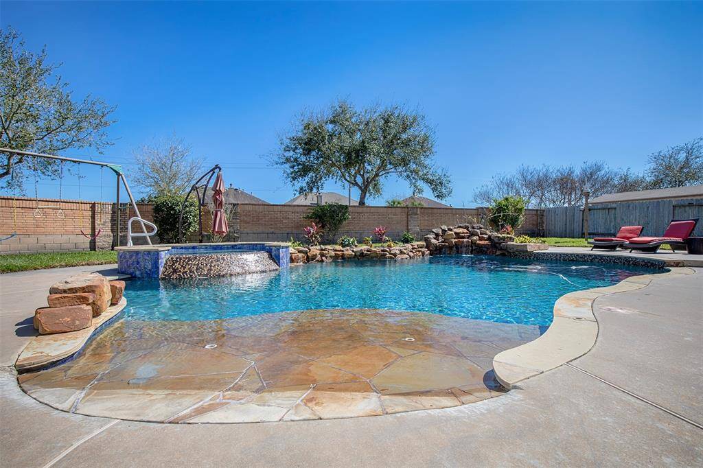 A sparkling pool in the backyard creates a perfect retreat for relaxation and entertaining.