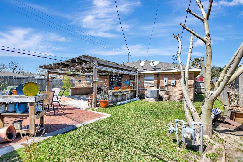 View of the other side of backyard with more grassy area for pets or kids to play