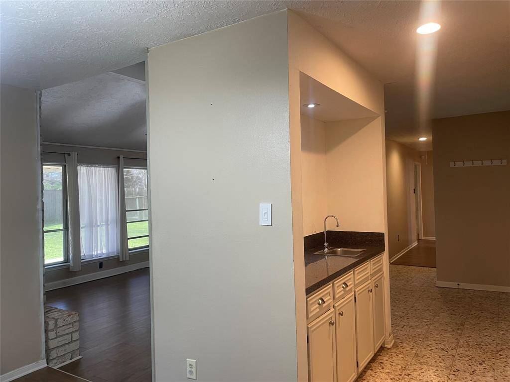 The dining room is adjacent to the kitchen (could easly be opened by removing the wall)
