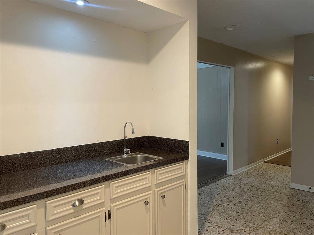 This wet bar could also be converted into an open bar by removing half wall & have bar stools on the other side