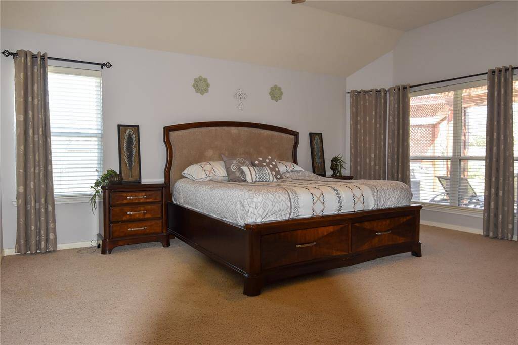 Retreat to the luxurious primary suite, complete with plush carpeting, a spacious layout, and a spa-like en-suite bath.