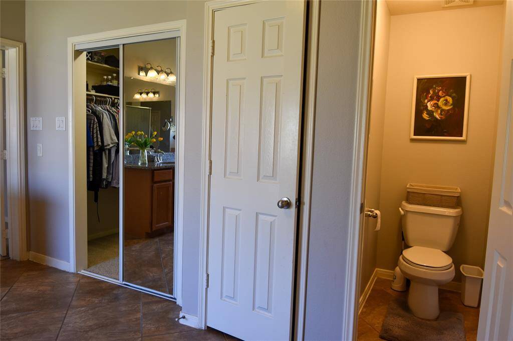 Step into the expansive walk-in closet, conveniently located within the primary bath for ultimate functionality.