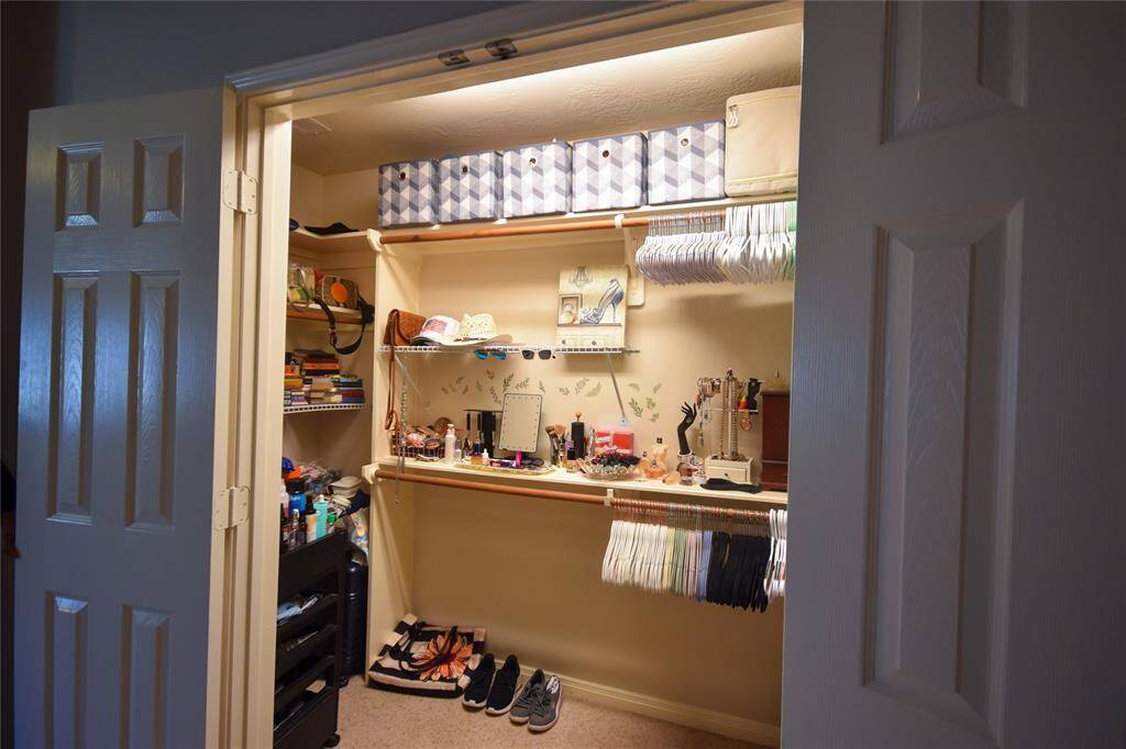 Featuring custom shelving, built-in storage, and ample space for an extensive wardrobe, this closet provides both organization and ease, making getting ready a breeze.