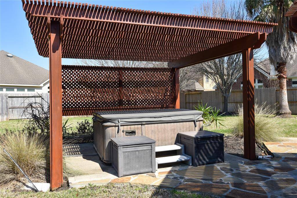Unwind in your private outdoor hot tub, the perfect retreat for relaxation after a long day. Surrounded by the spacious backyard and serene atmosphere, this spa-like feature offers a luxurious way to soak, de-stress, and enjoy year-round comfort.