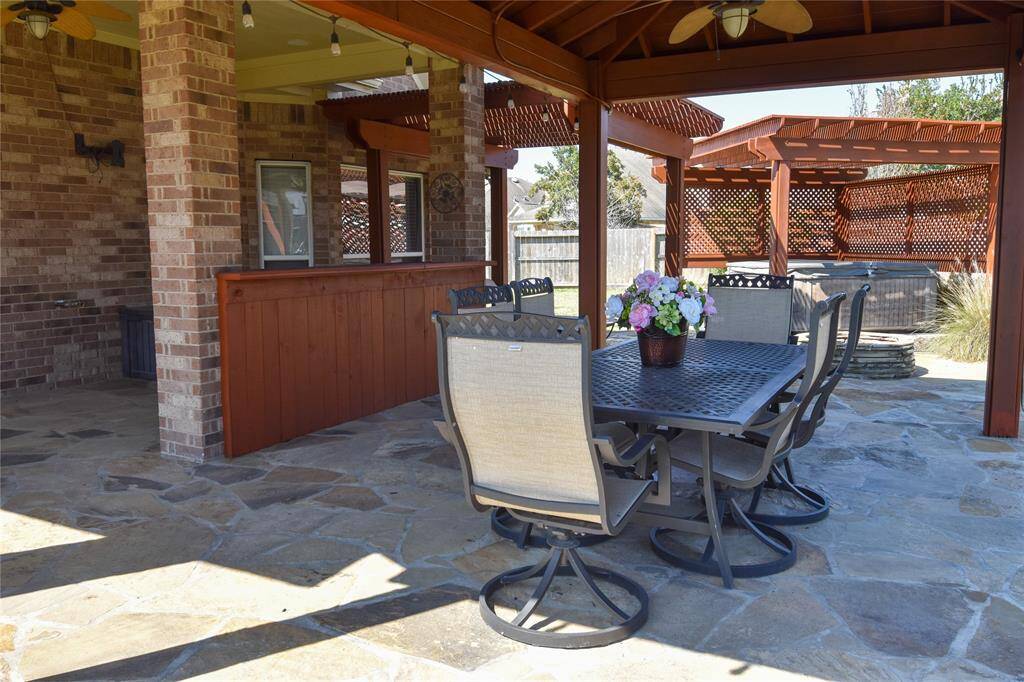 Whether you're grilling, mixing cocktails, or enjoying a casual evening with friends, this stylish and functional bar area makes outdoor living effortless and enjoyable.