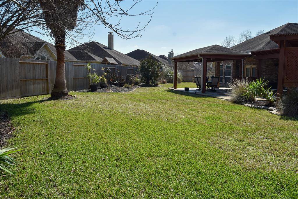 Huge green space is your blank canvas!  Ready for you dream pool, garden or playground for the kids.