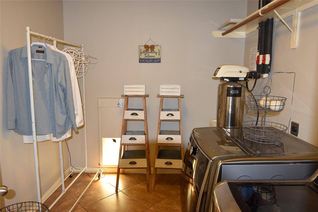 Designed for both functionality and convenience, the spacious laundry room offers everything you need to streamline household chores.