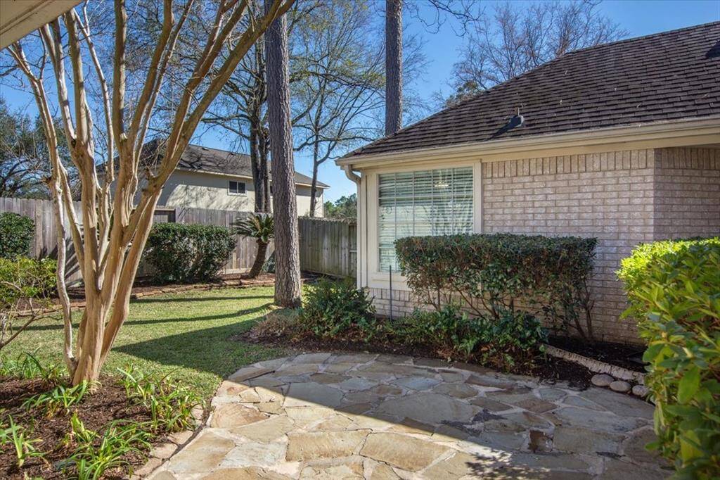 Outdoor living with a stone patio and lots of greenspace!