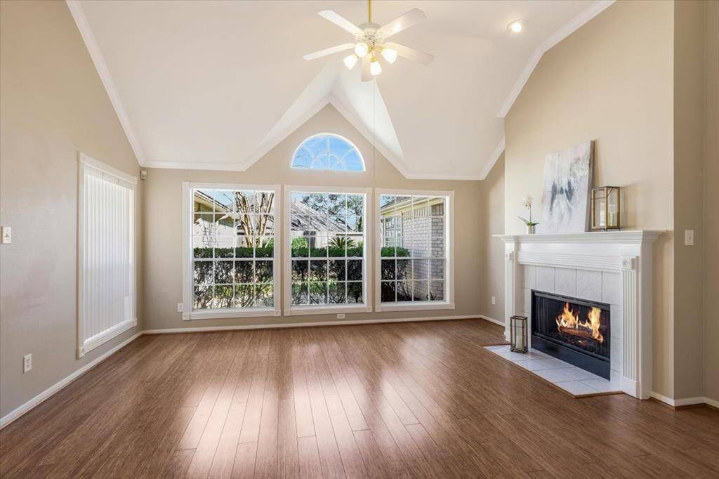 The living room is spacious with high ceiling and recent bamboo flooring. Relax and unwind around the beautiful fireplace!