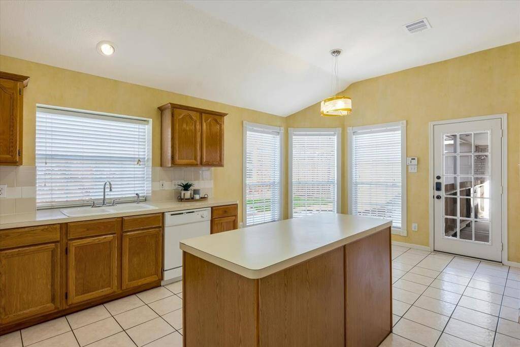 Sunny casual breakfast area with patio access helps transition to outdoor living seamlessly.
