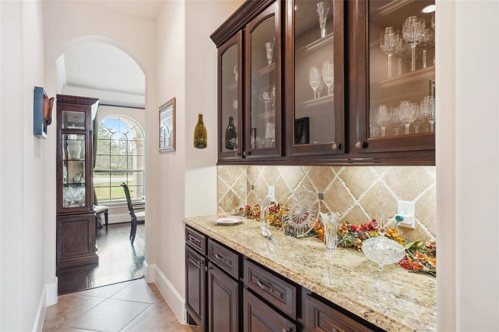 Butler's pantry for storage and entertaining.   This is the perfect transition from kitchen to dining room.  Food can be served; drinks can be made and the fun begins!