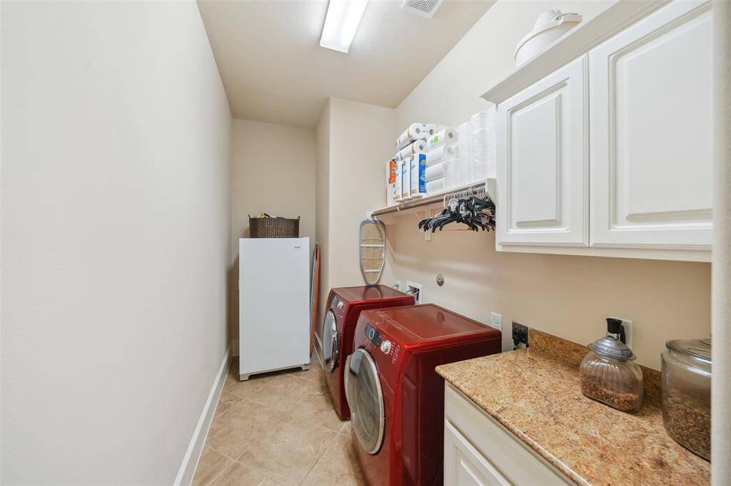 Nice, large laundry room.