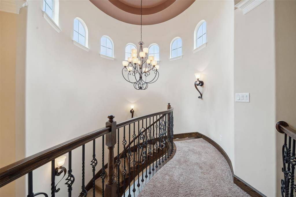 The turret is bathed in light as it is adorned with graceful arched windows.