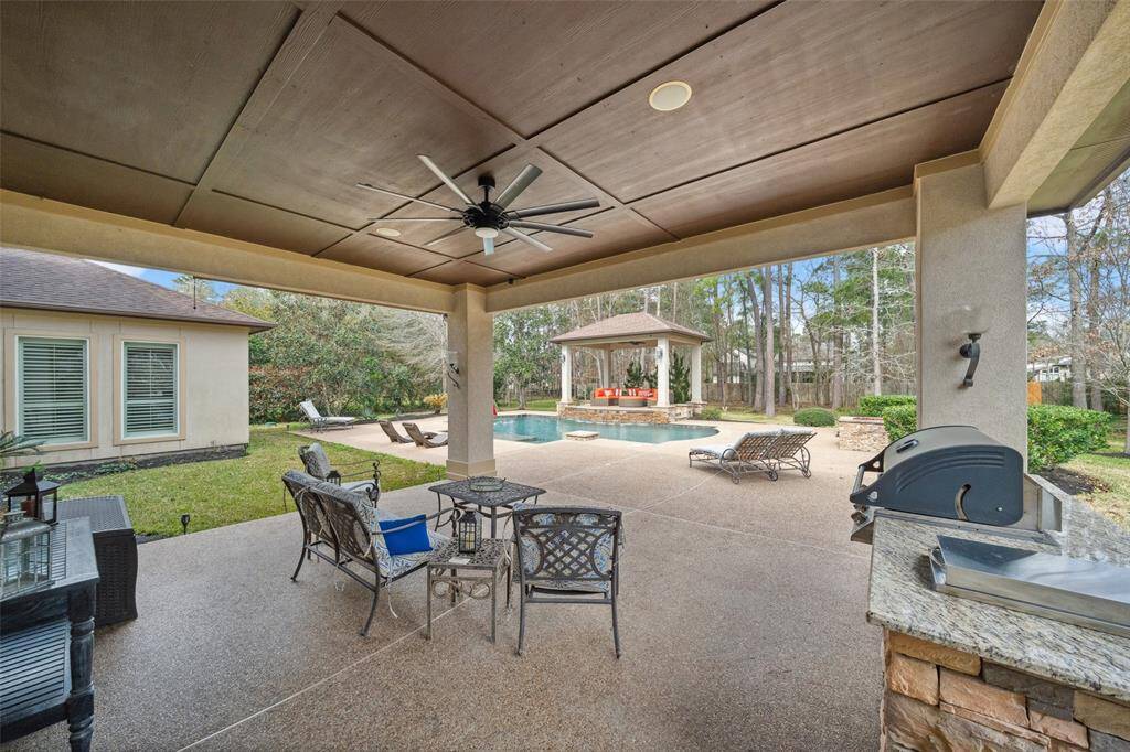 Enjoy hanging out on this covered patio with summer kitchen.