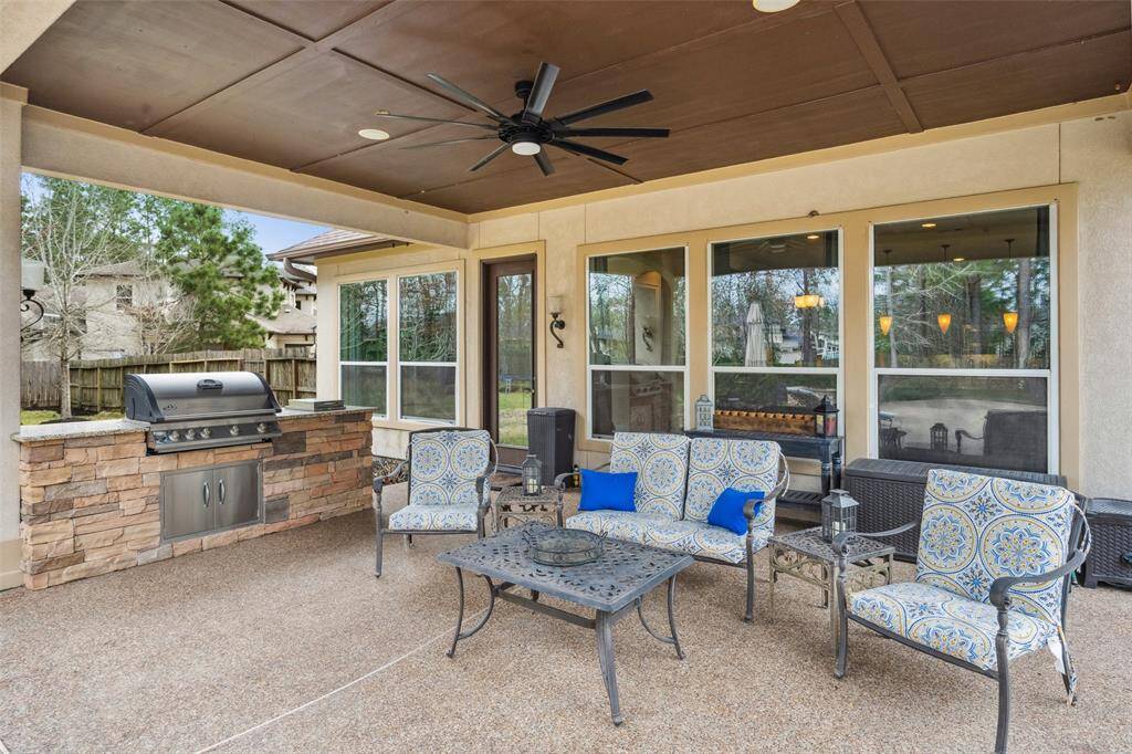 A close up of the covered patio and outdoor kitchen.