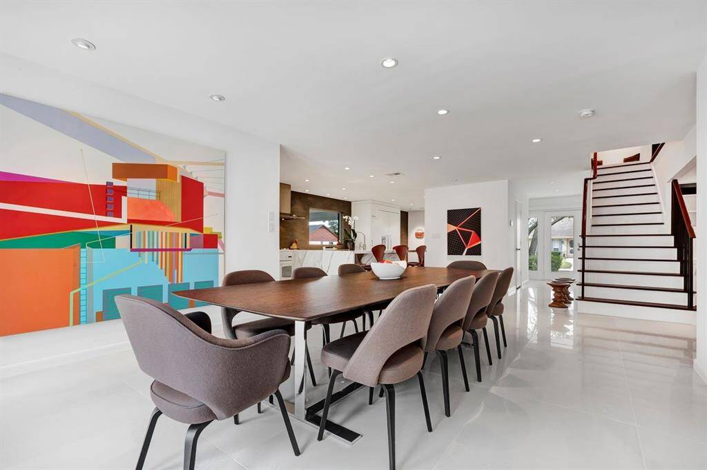 At the center of the home, the large-format porcelain tile enhances the design with sleek aesthetics and commercial-grade durability.  Rich luxury lighting elements, including recessed lighting and abundant natural light, are strategically placed to illuminate your artwork collection and create a radiant, gallery-like ambiance.