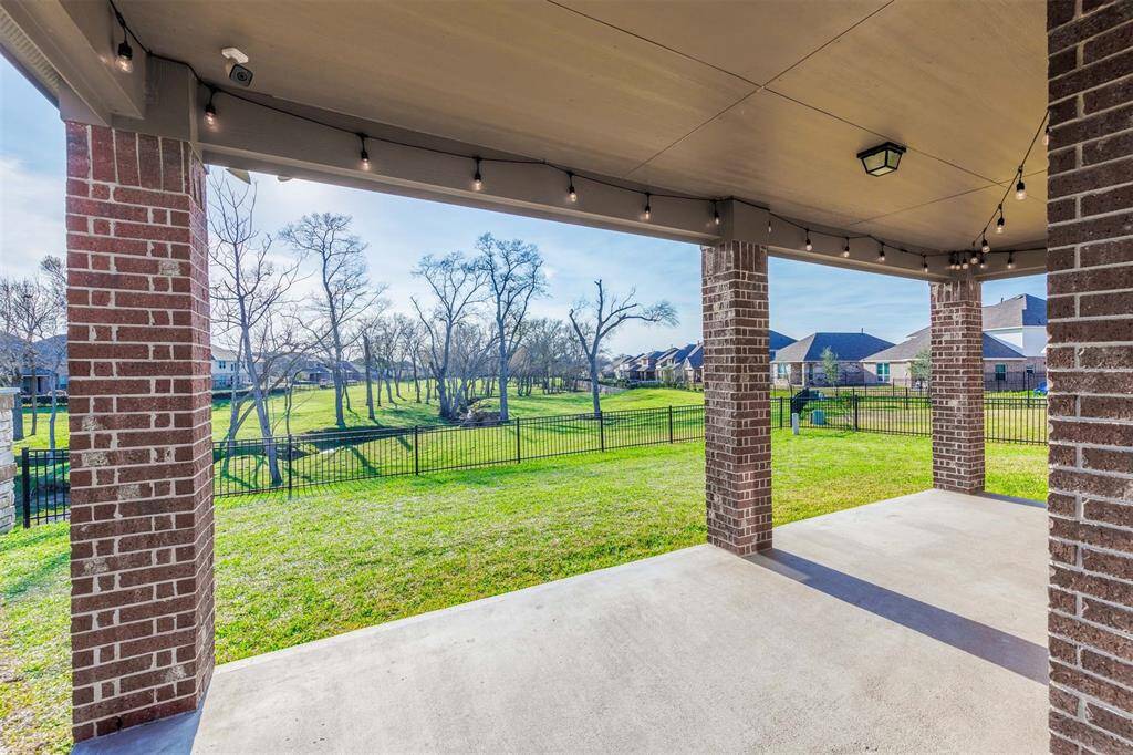 Step out back to an extended covered patio with clear breathtaking views of the greenbelt through a wrought iron fence, ready for outdoor entertaining and watching the Texas sunsets!