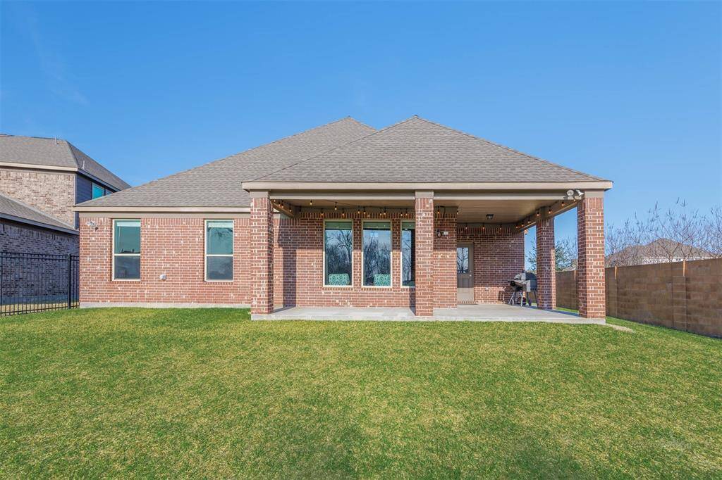 Step out back to the extended covered patio and enjoy the expansive, unobstructed view of the lush greenbelt behind the home. With no back neighbors, you can relax in privacy and take in the serene surroundings - perfect for outdoor entertaining or unwinding in the fresh air!