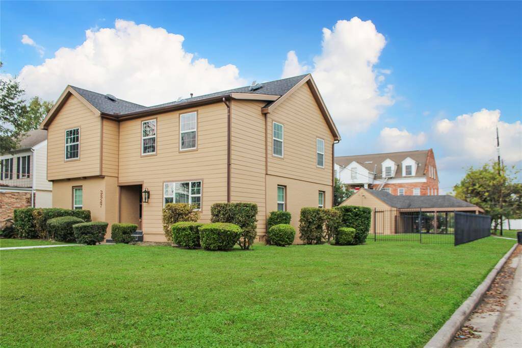 Prime corner lot offering spacious outdoor potential and excellent curb appeal.