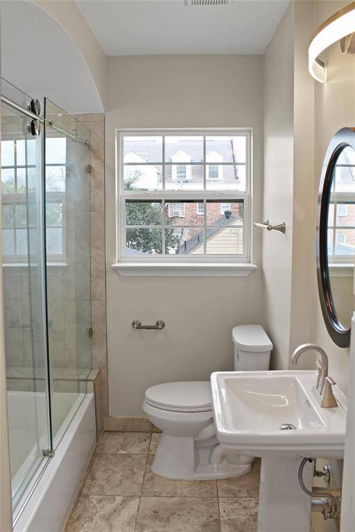 Bright and inviting hall bathroom with modern fixtures and a spacious shower.