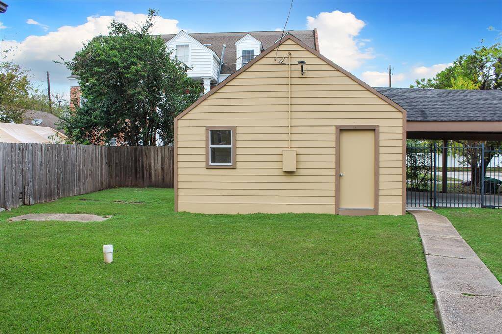Charming detached garage with convenient laundry room.