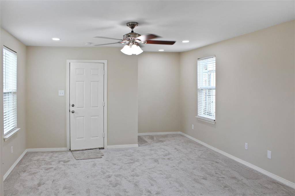 Spacious downstairs primary bedroom with a cozy nook.
