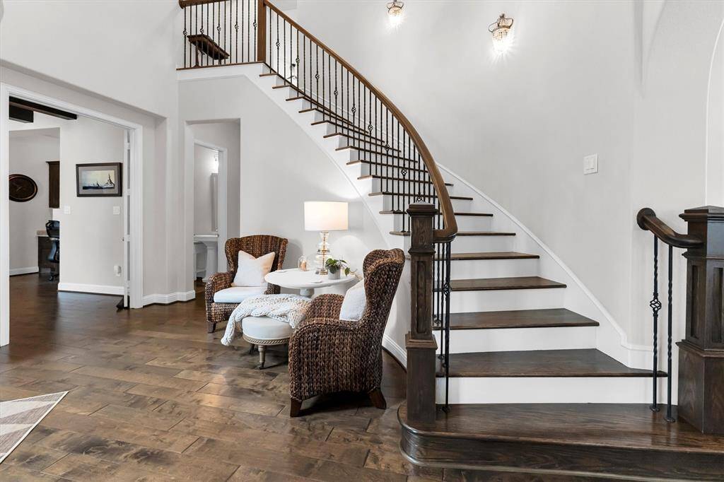 Stairway and high ceiling entry to house