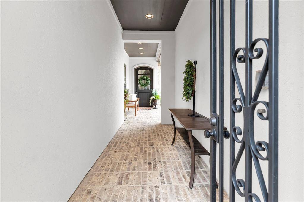 Entry to front door and courtyard to the right