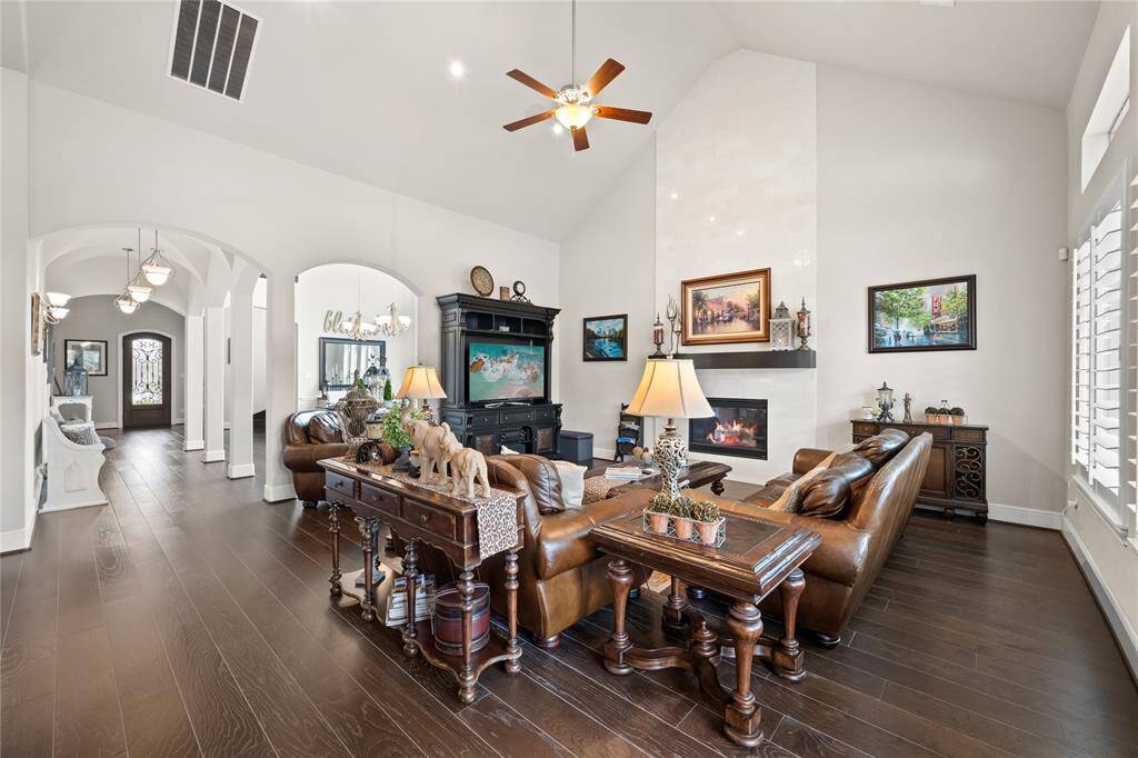 Spacious den with high ceilings & marble fireplace!