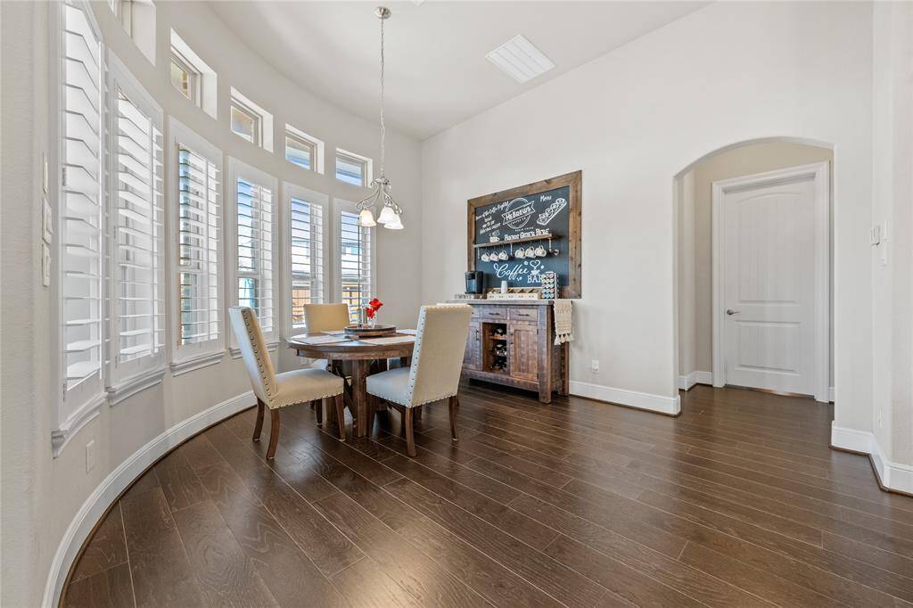 Breakfast room w/wrap around windows to the pool & patio area!
