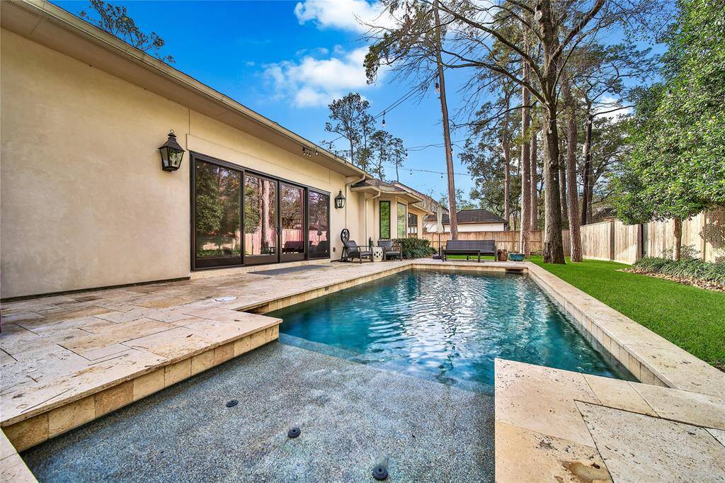 Beautiful backyard with pool and plenty of yard space.
