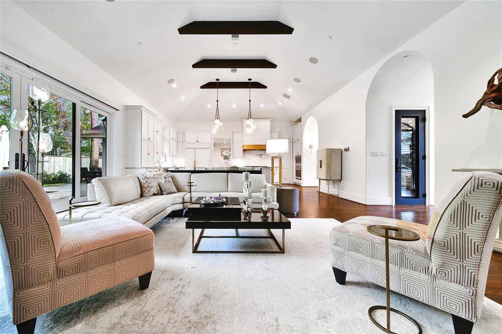 The heart of the home is this spacious family room with gorgeous wood beamed ceiling.