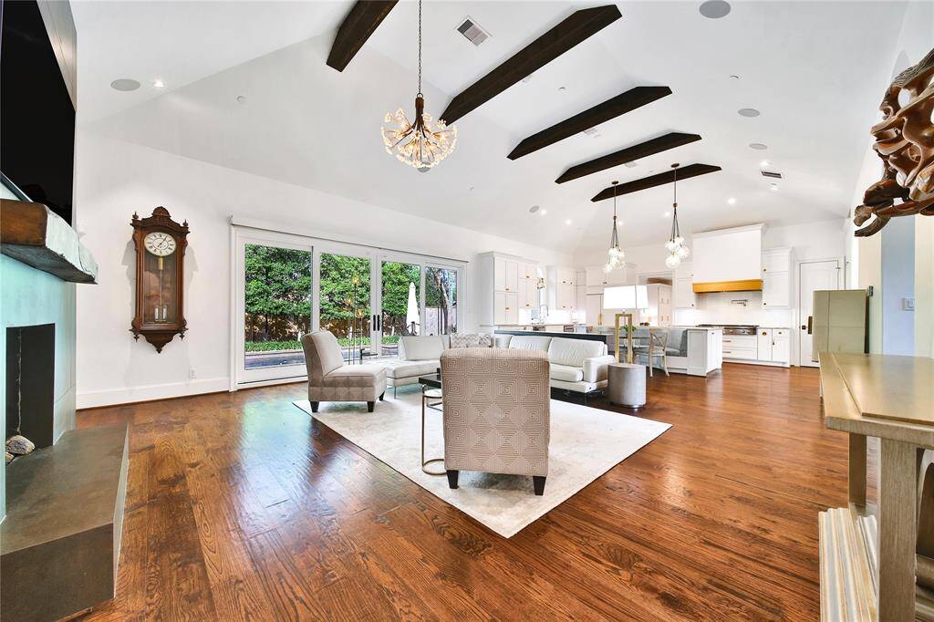 The heart of the home is this spacious family room with gorgeous wood beamed ceiling.