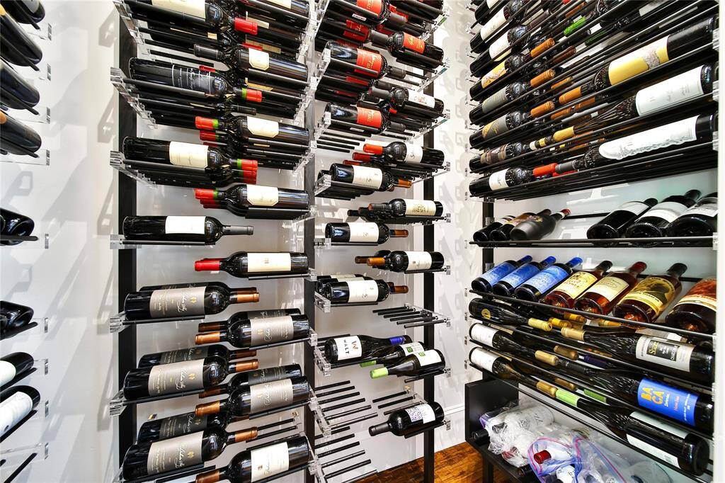 Temperature controlled wine room that can hold up to 400 bottles.