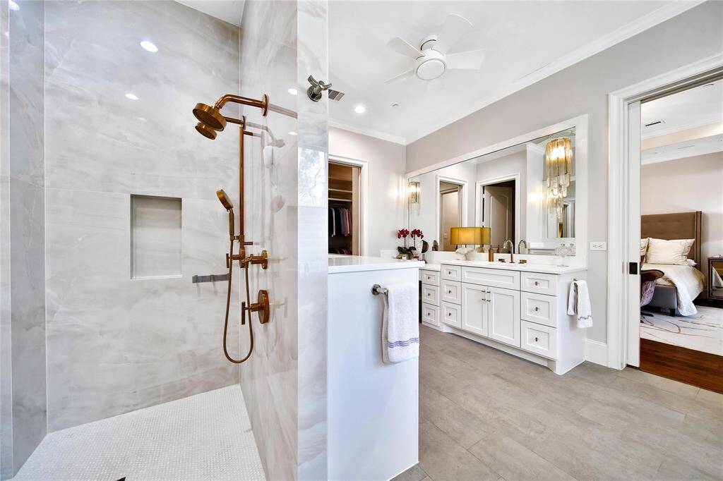 Primary bathroom features spacious shower and soaking tub.
