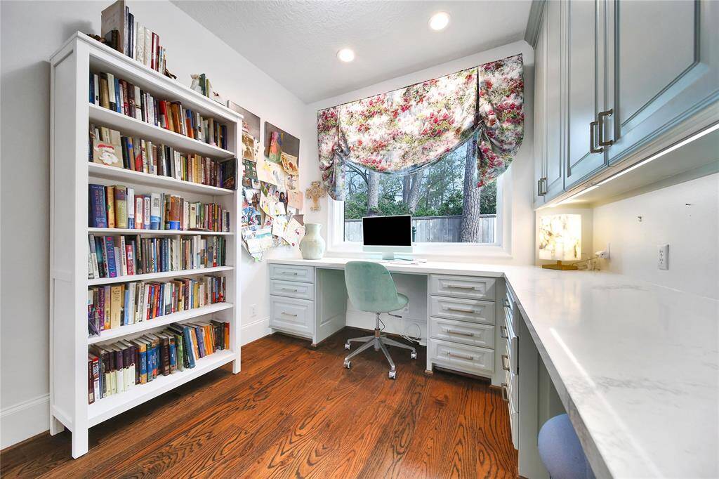 Office nook with beautiful built ins located off the flex room.